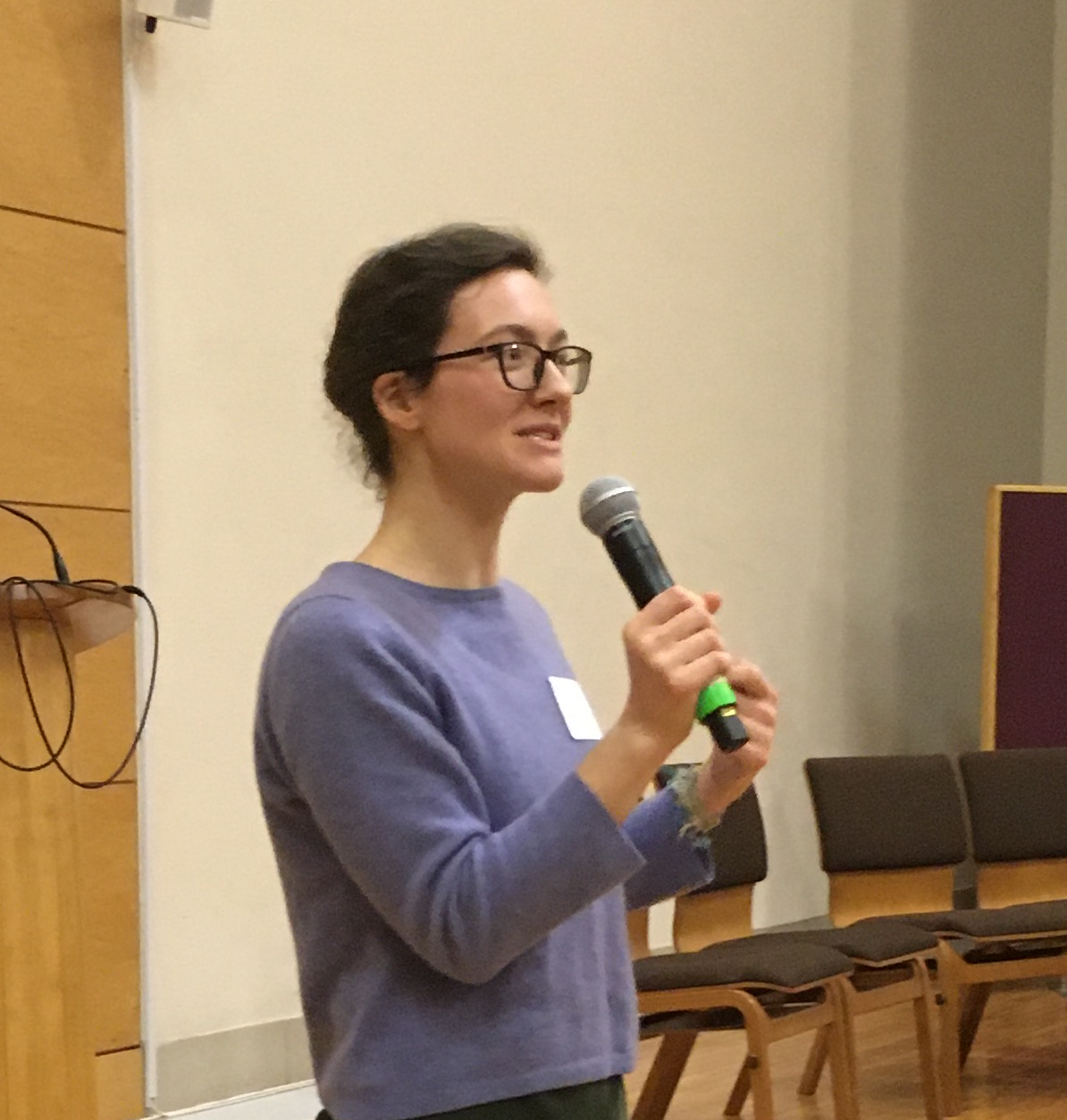 Rebecca speaking at an outreach event